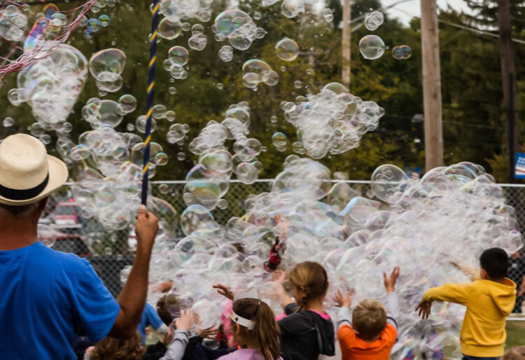 Group of people playing with bubbles